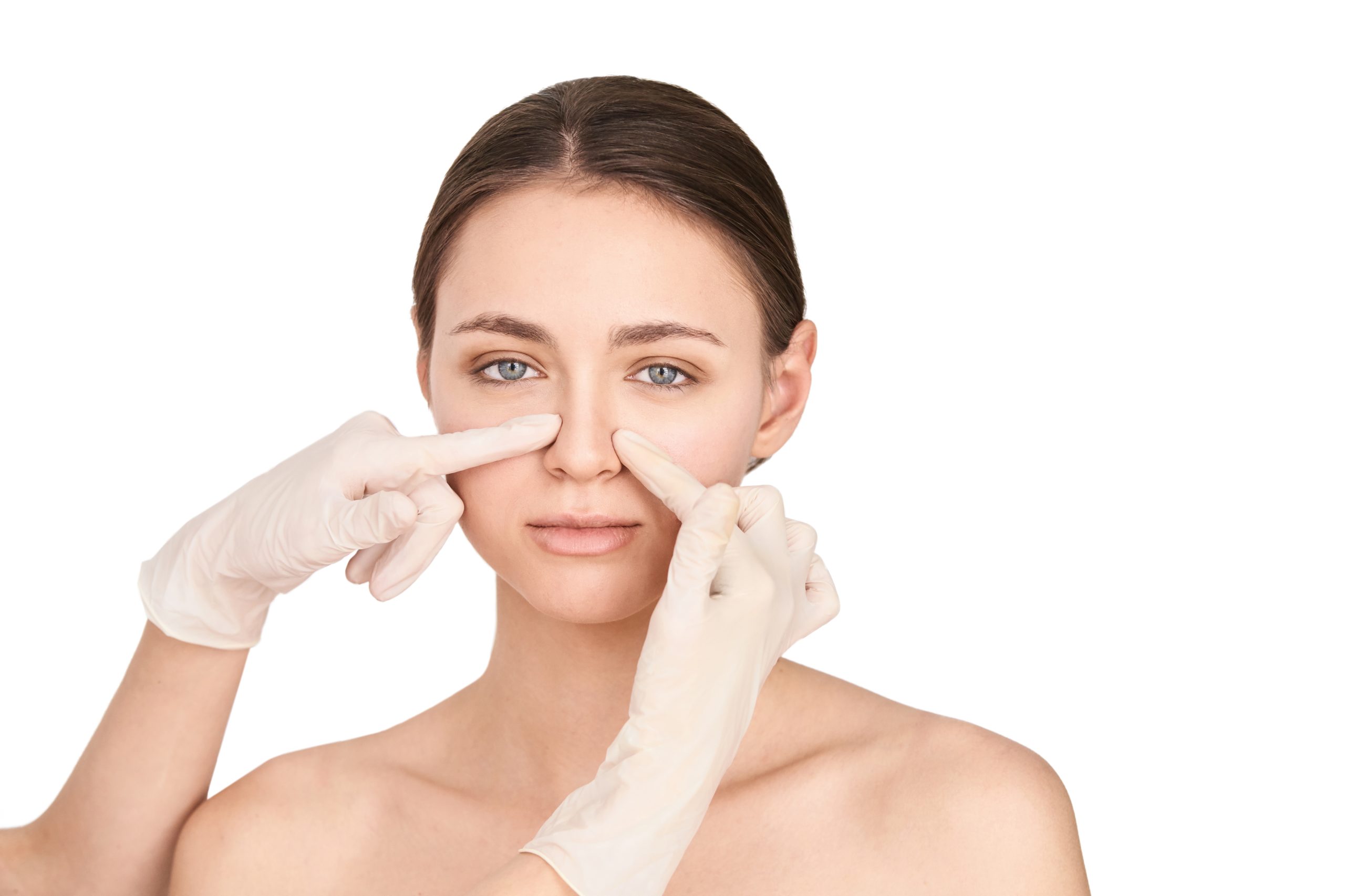 Woman having her nose examined