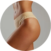 Person's lower back and hip area showing skin tone and contouring