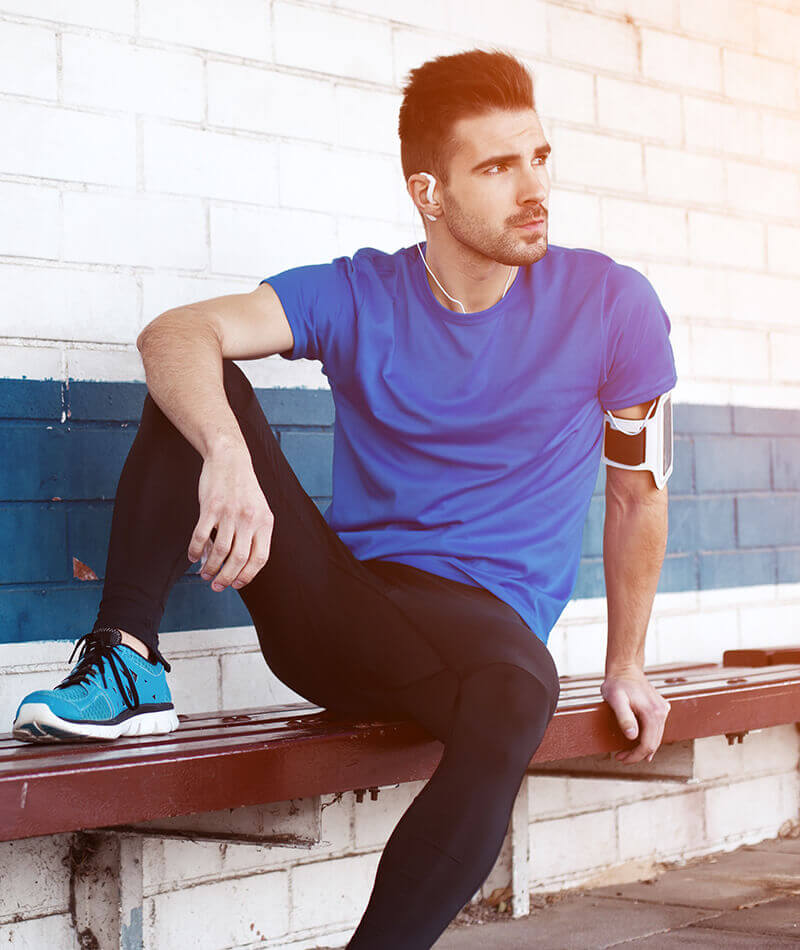 Fit man resting after a jog