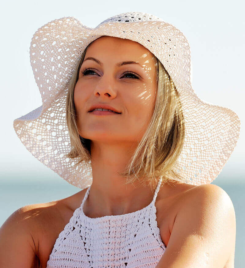 Young woman in a sun hat