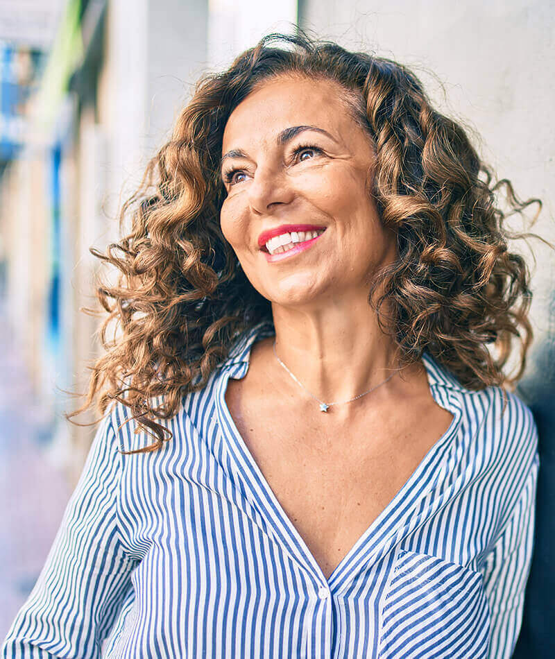 Mature woman with curly hair