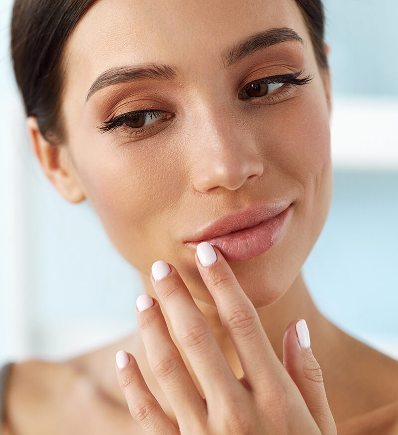 Woman touching her lip