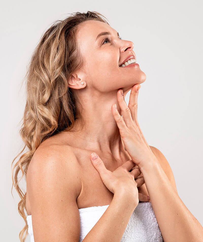 Woman touching her neck and chin