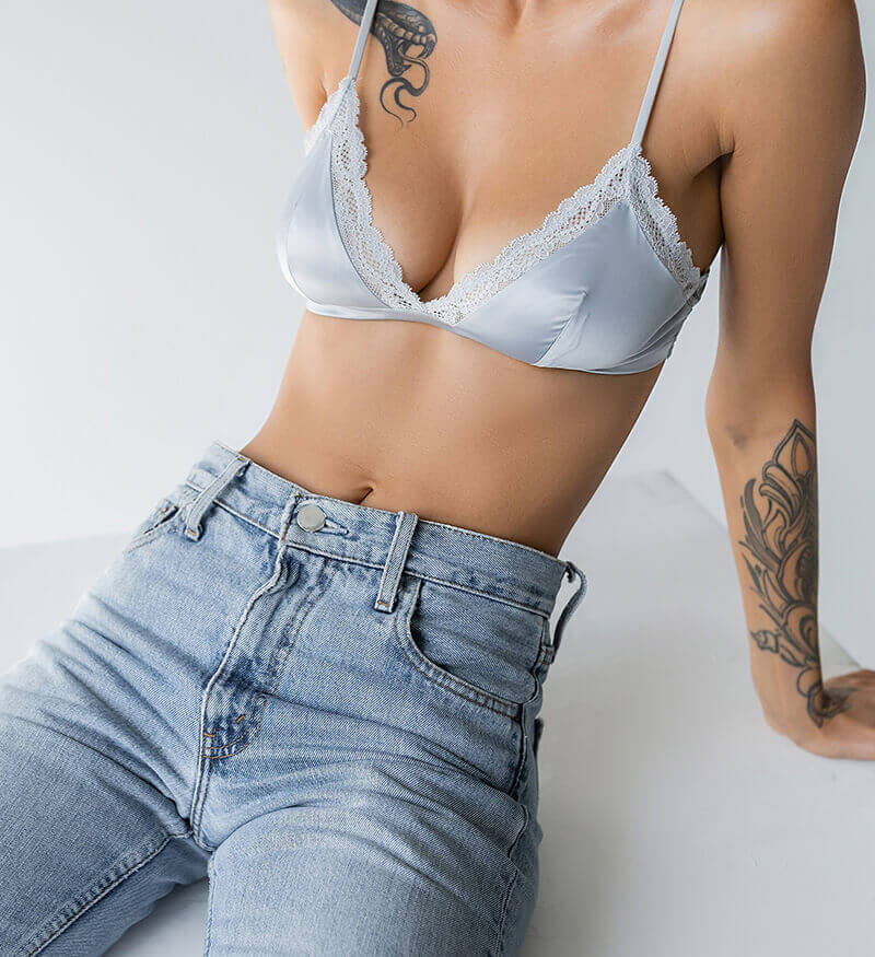 woman in jeans and a bra