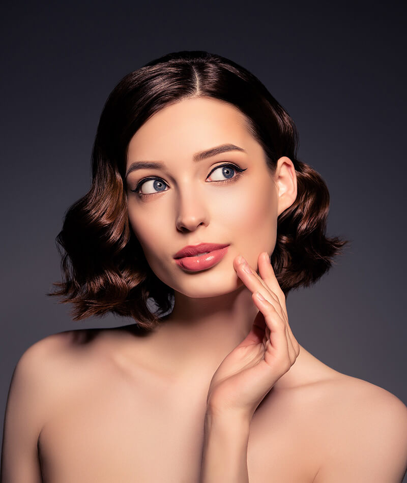 Young woman touching her chin