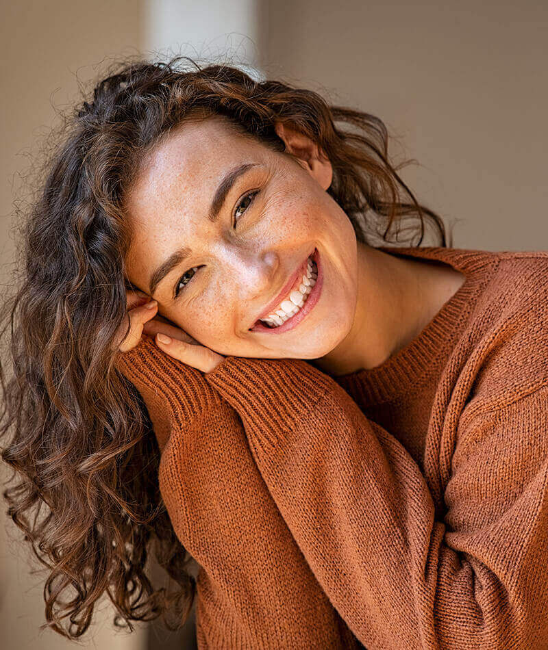 woman in orange sweater