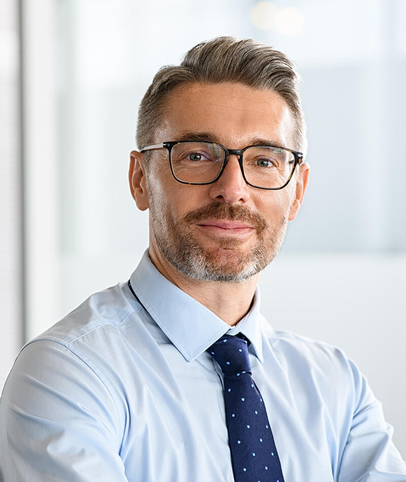 Man with glasses in a tie