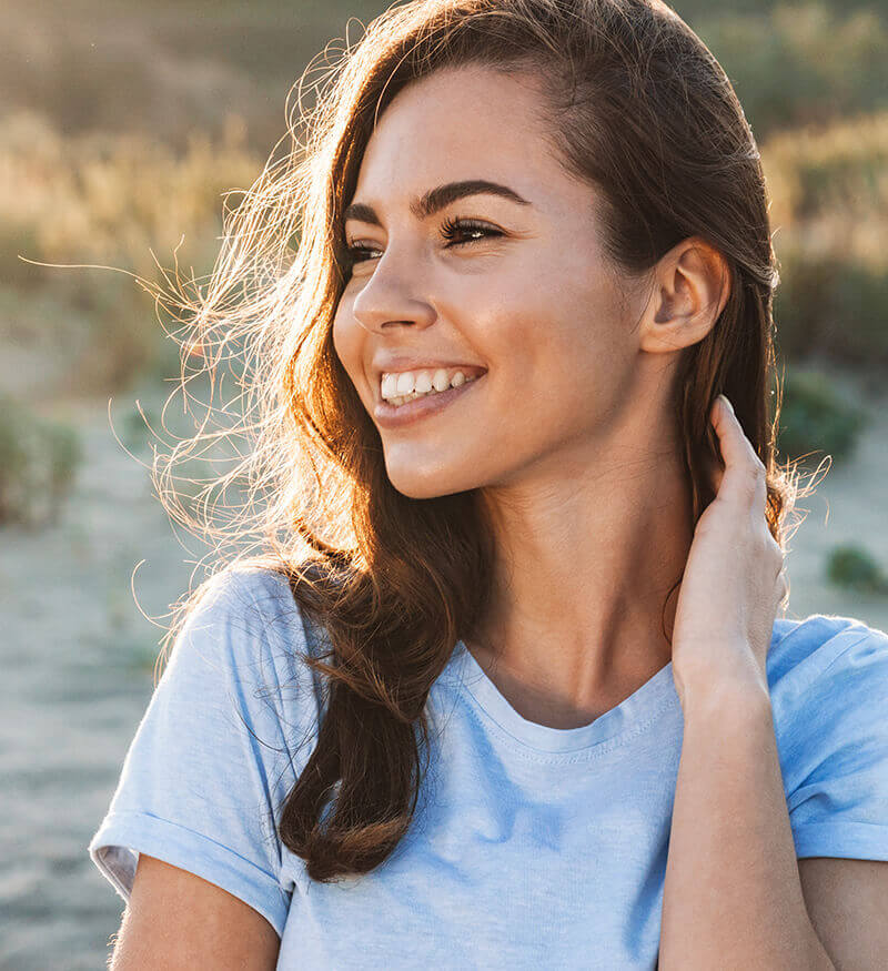 smiling woman at golden hour