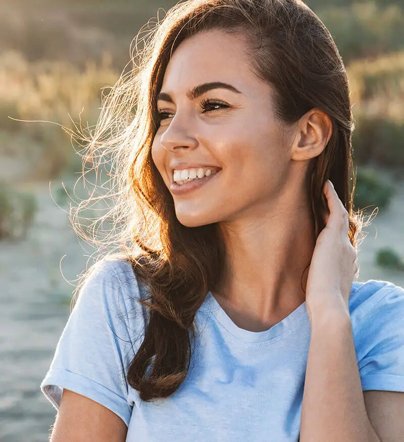 smiling woman at golden hour