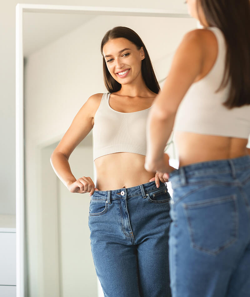 Woman looking at herself in the mirror